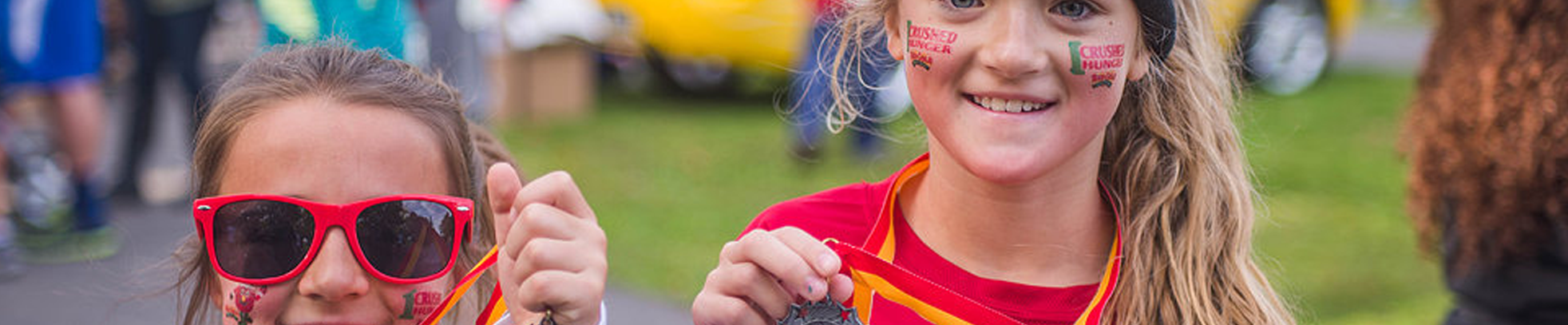 Girls show off medals at Crush Hunger