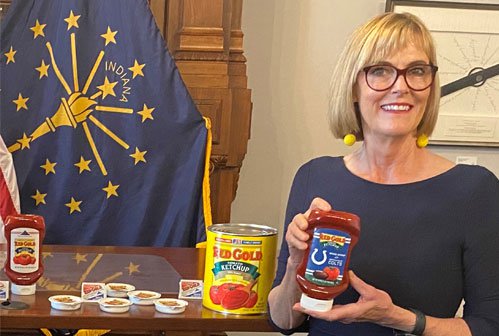 Image of Red Gold VP Tim Ingle and Lt Governor Suzanne Crouch with both holding Red Gold Ketchup